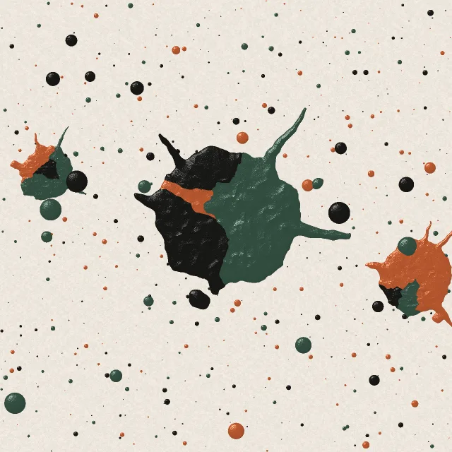 The Paint splatter backdrop: rust, green and black paint thrown at a cream wall
