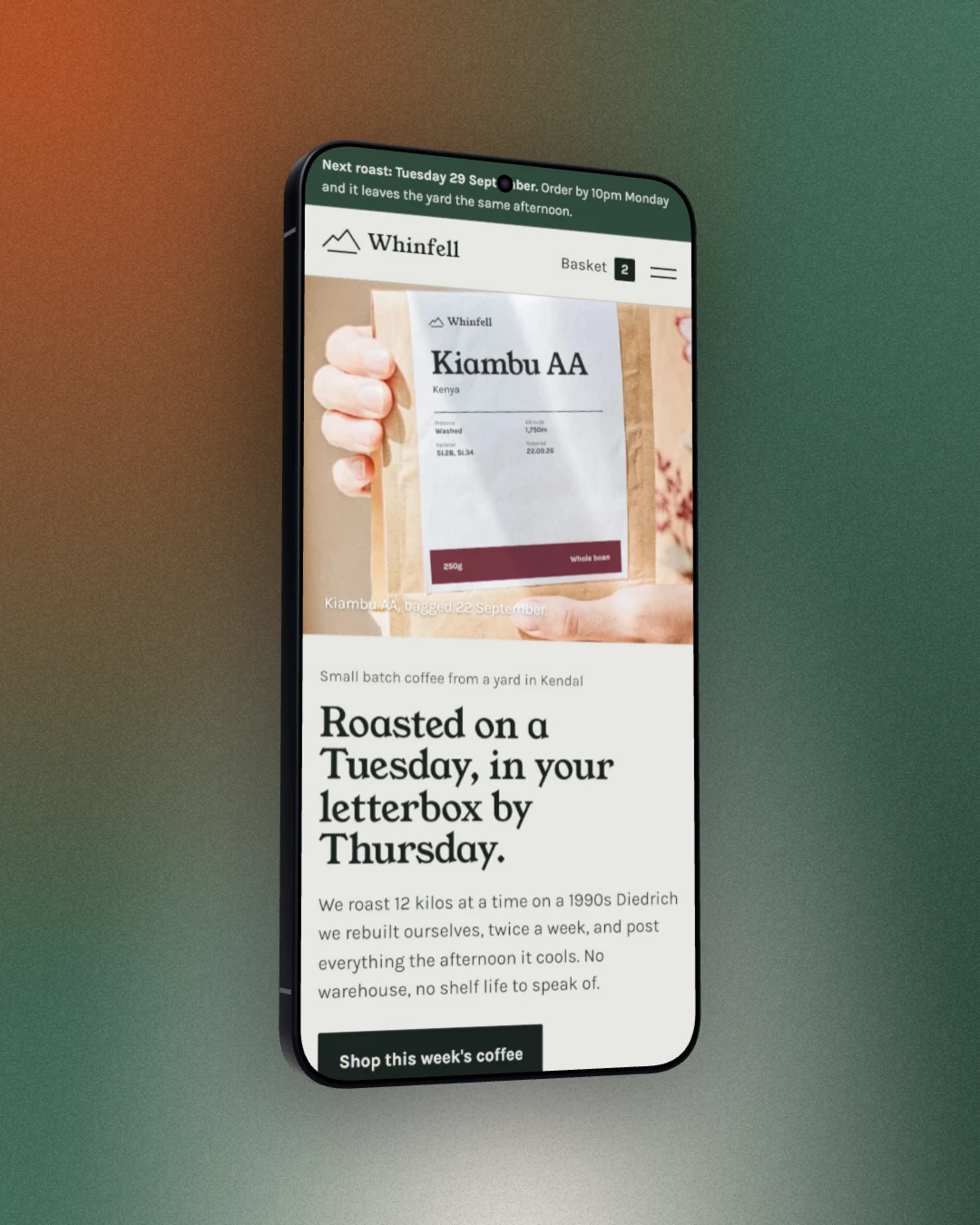 A coffee shop's mobile site framed in a 3D Galaxy S26 Ultra, turned slightly to the right, on a blended rust and moss green backdrop